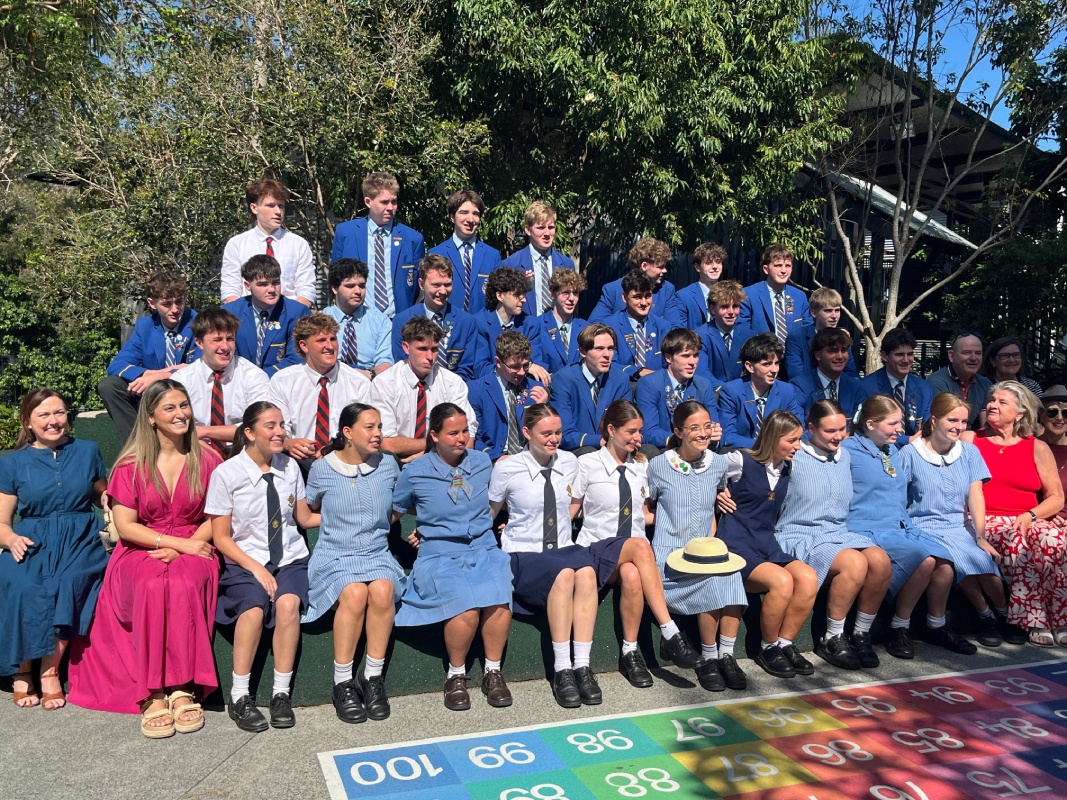 Former and current students gathered together at school, celebrating community connection and shared school history